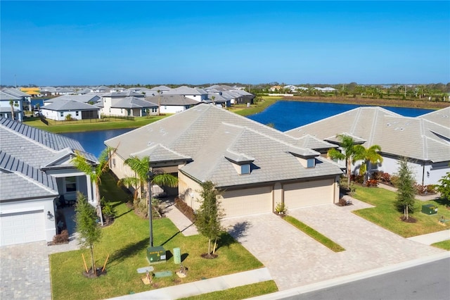 birds eye view of property with a water view