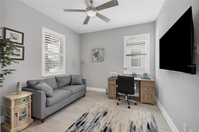 office space featuring ceiling fan and light wood-type flooring