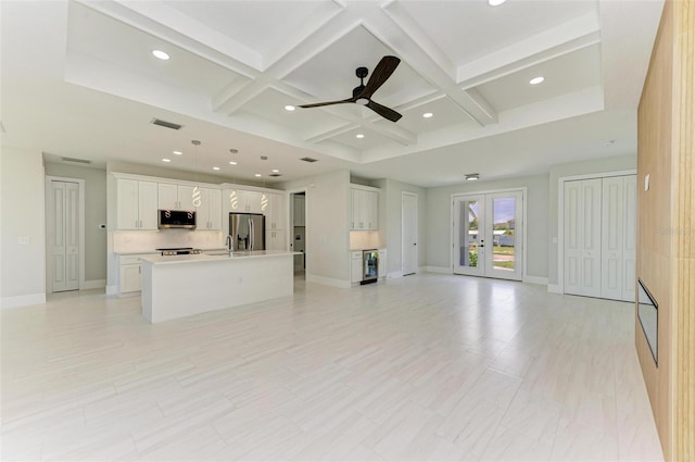 1010 Acadia Rd, Venice, FL 34293 - unfurnished living room featuring coffered ceiling, french doors, recessed lighting, ceiling fan, and baseboards