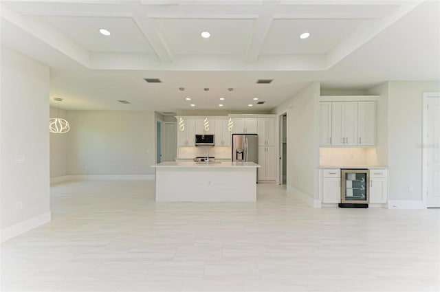 unfurnished living room featuring beverage cooler, coffered ceiling, bar, and beamed ceiling