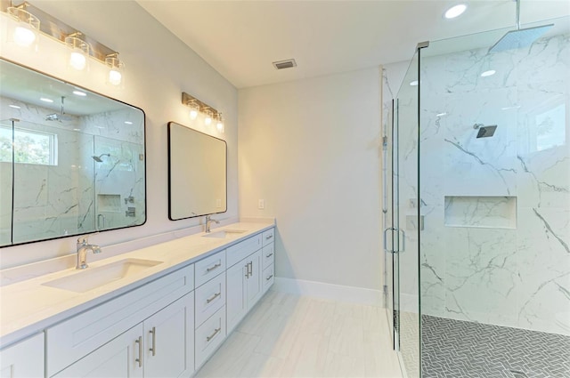 1010 Acadia Rd, Venice, FL 34293 - bathroom with marble finish flooring, a marble finish shower, double vanity, recessed lighting, and baseboards