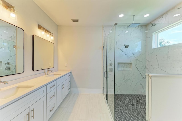 bathroom with walk in shower and vanity