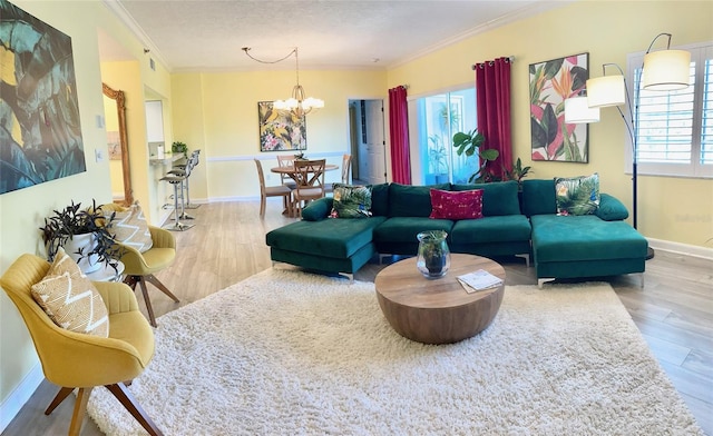 living room with plenty of natural light, light hardwood / wood-style flooring, and ornamental molding