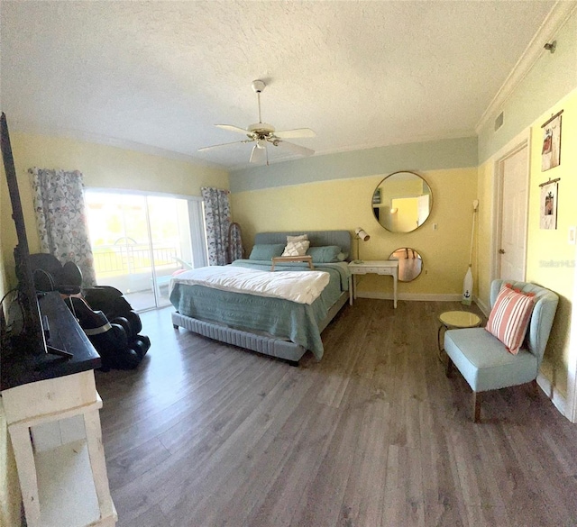 bedroom with hardwood / wood-style flooring, ceiling fan, a textured ceiling, and access to outside