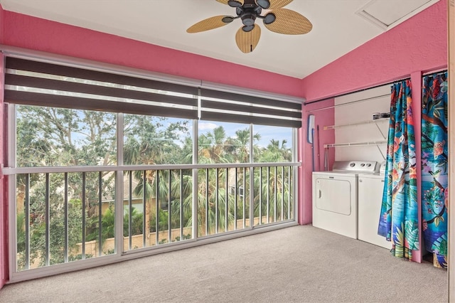 clothes washing area featuring separate washer and dryer, ceiling fan, plenty of natural light, and carpet