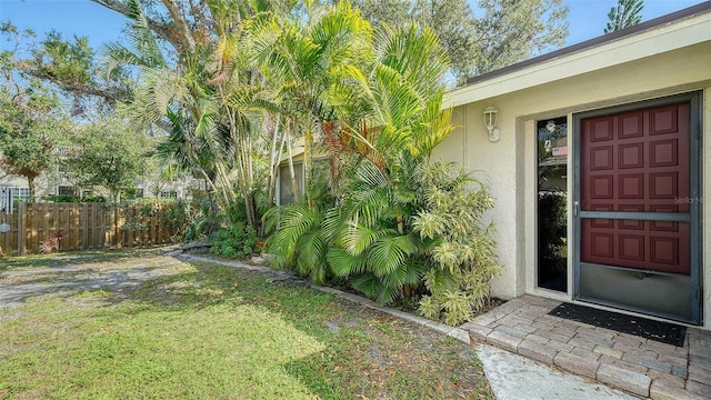 property entrance with stucco siding