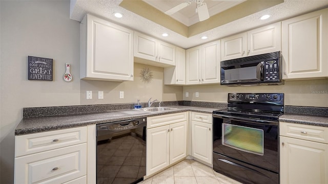 kitchen with light tile patterned flooring, white cabinetry, sink, black appliances, and ceiling fan