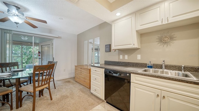 kitchen with sink, ceiling fan, a textured ceiling, light colored carpet, and black dishwasher