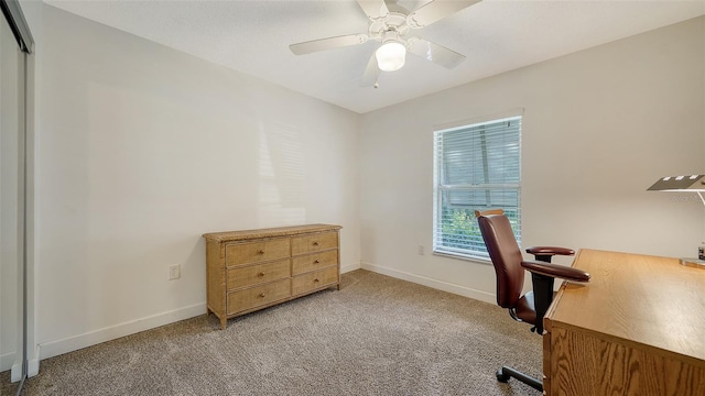 office area with light colored carpet and ceiling fan