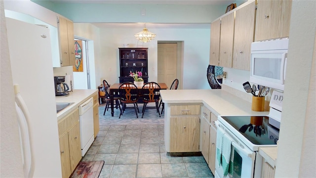 kitchen with pendant lighting, light brown cabinets, white appliances, an inviting chandelier, and light tile patterned floors