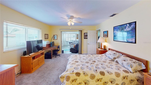 carpeted bedroom featuring ceiling fan