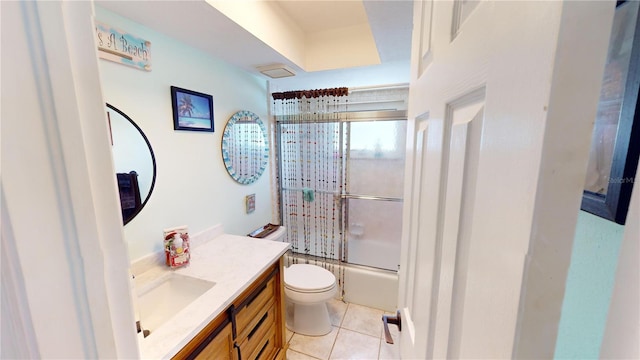 full bathroom featuring tile patterned flooring, vanity, toilet, and enclosed tub / shower combo