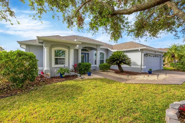 single story home featuring stucco siding, driveway, a shingled roof, a front yard, and an attached garage