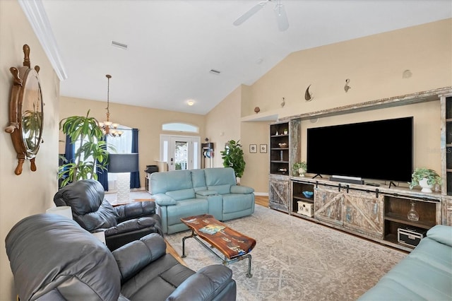 living room with french doors, light hardwood / wood-style flooring, ceiling fan, and vaulted ceiling