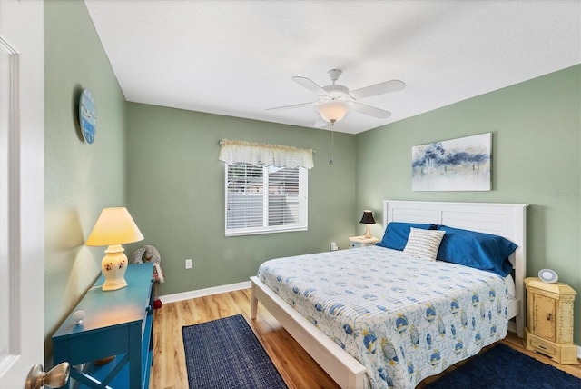 bedroom featuring wood-type flooring and ceiling fan