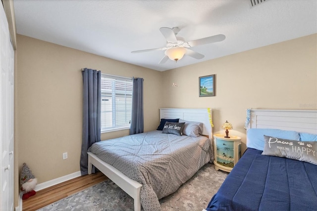 bedroom featuring hardwood / wood-style floors and ceiling fan