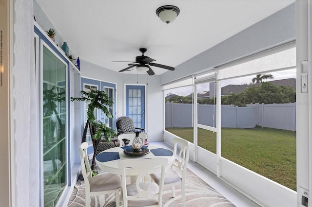 sunroom / solarium featuring ceiling fan