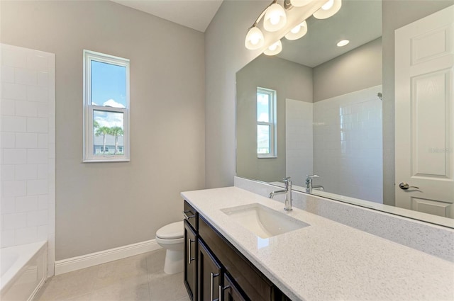 full bathroom featuring toilet, vanity, tile patterned floors, and plenty of natural light