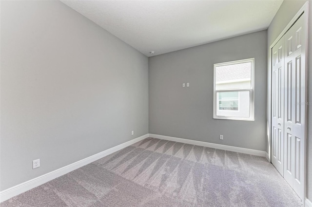 unfurnished bedroom with carpet flooring