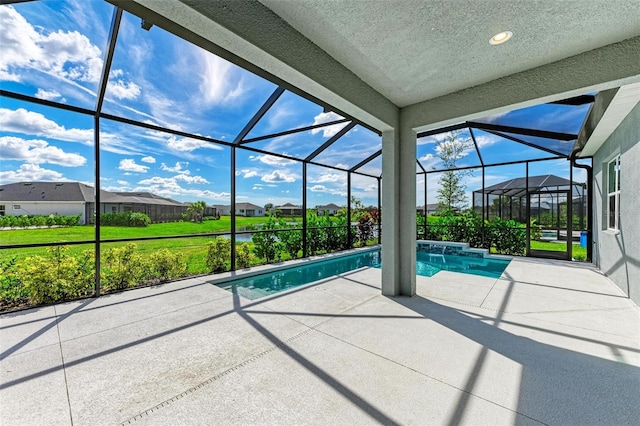 view of swimming pool with a lawn, a lanai, and a patio area