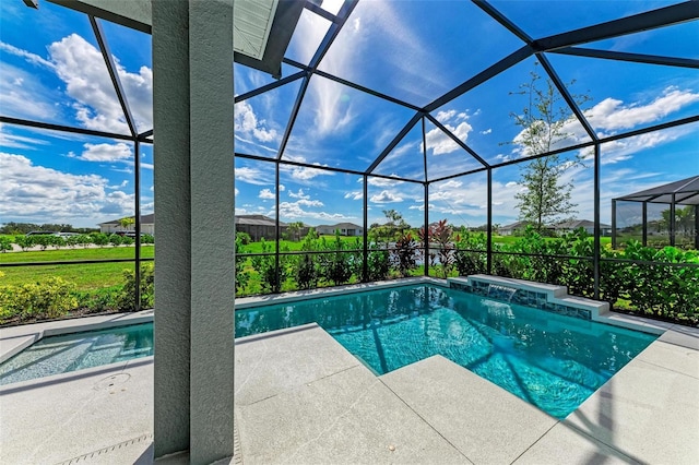 view of swimming pool with a patio area, a lanai, and pool water feature