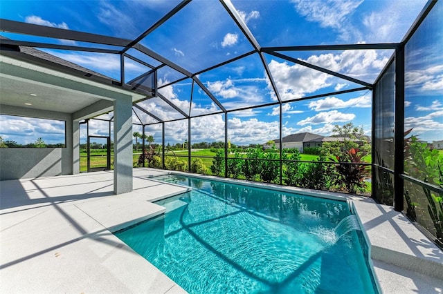 view of swimming pool featuring a patio, a lanai, and pool water feature