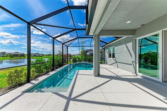 view of swimming pool with glass enclosure, a patio area, and a water view