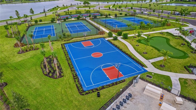 view of sport court with a water view and tennis court