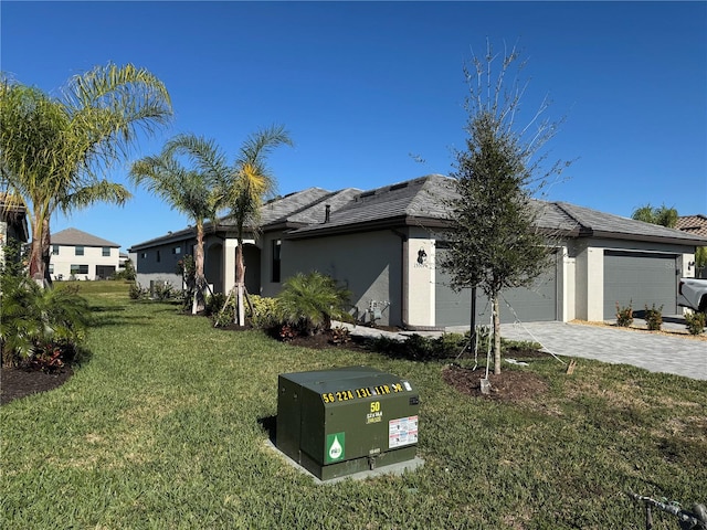 exterior space with a garage and a front lawn