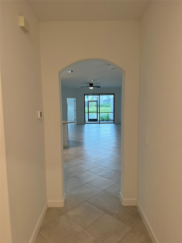 corridor with light tile patterned floors