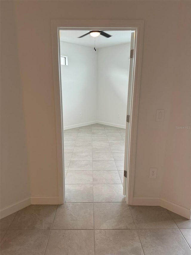 corridor with light tile patterned floors