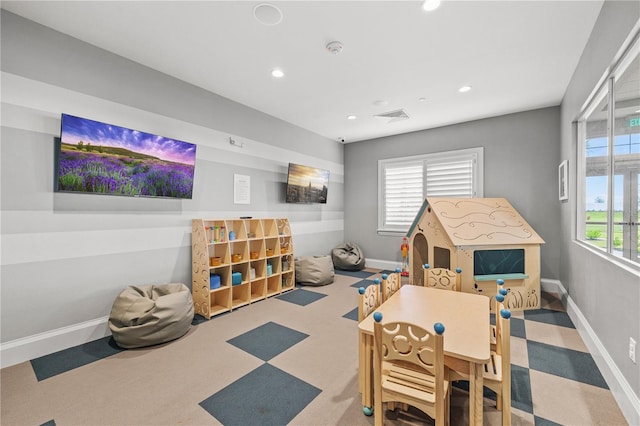 recreation room with carpet floors