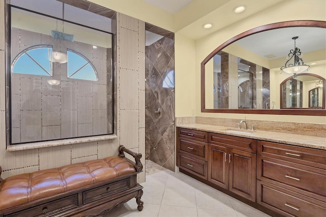 bathroom featuring tile walls, tile patterned flooring, and vanity