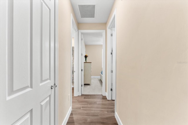 corridor featuring hardwood / wood-style floors