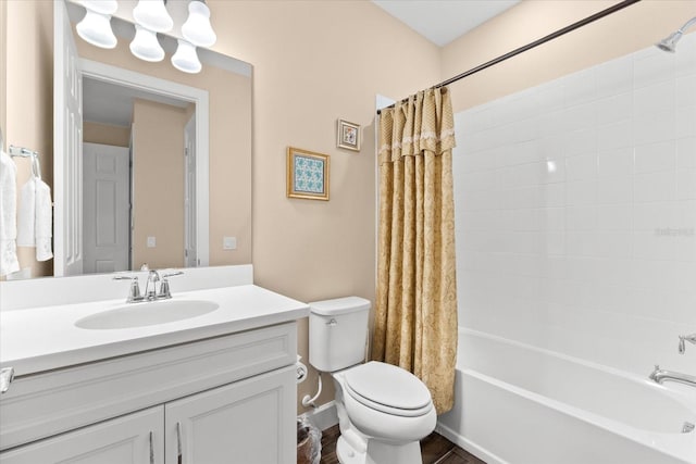 full bathroom with wood-type flooring, vanity, shower / bath combo, and toilet