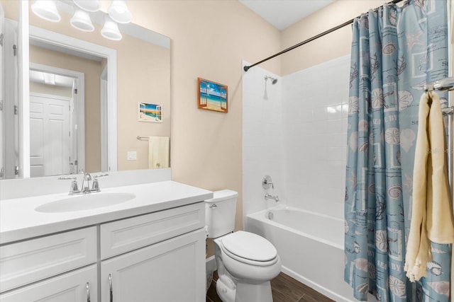 full bathroom featuring hardwood / wood-style flooring, vanity, shower / bathtub combination with curtain, and toilet