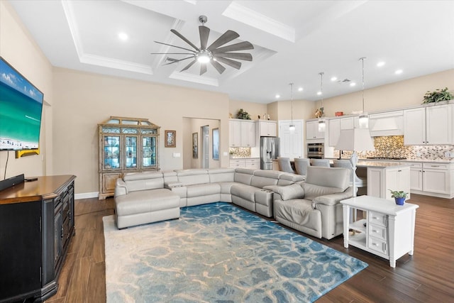 living room with dark hardwood / wood-style flooring, coffered ceiling, ornamental molding, and ceiling fan