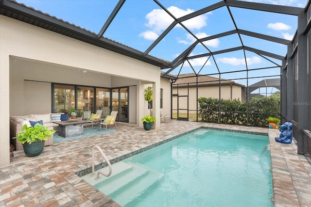 view of pool with a lanai, outdoor lounge area, a patio, and pool water feature