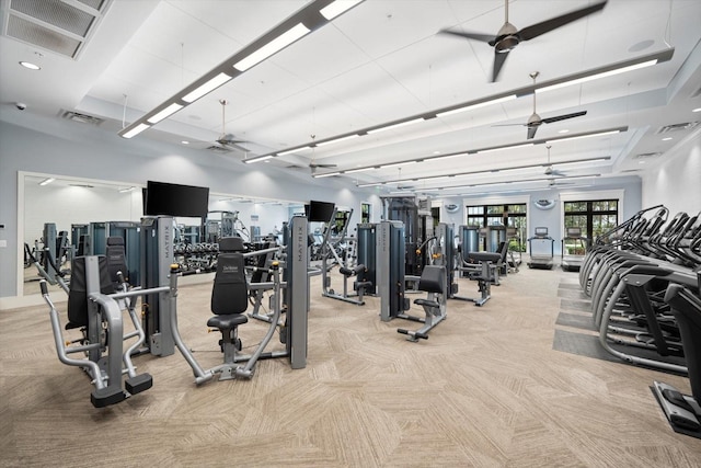 gym featuring light colored carpet