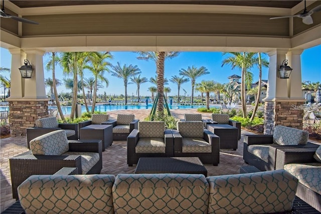 view of patio / terrace featuring outdoor lounge area and a water view