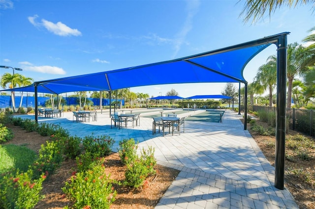 view of property's community with a patio area