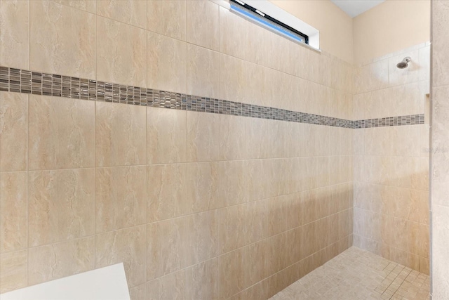 bathroom featuring a tile shower