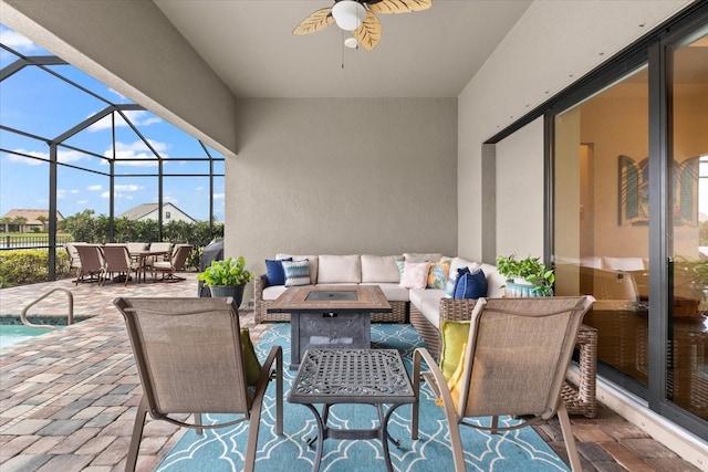 view of patio with glass enclosure, outdoor dining space, a ceiling fan, and an outdoor hangout area
