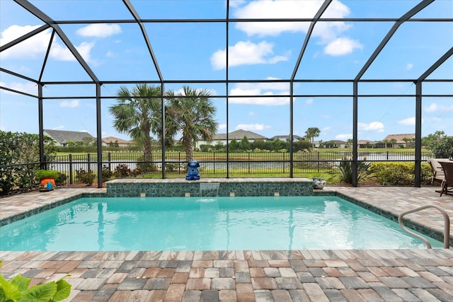 view of swimming pool featuring glass enclosure, a fenced in pool, and fence