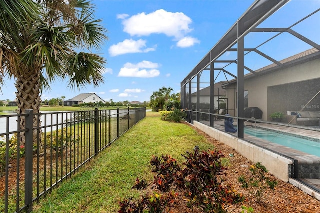 view of yard with glass enclosure, a fenced backyard, and a fenced in pool