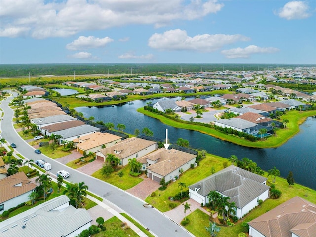 bird's eye view featuring a residential view and a water view