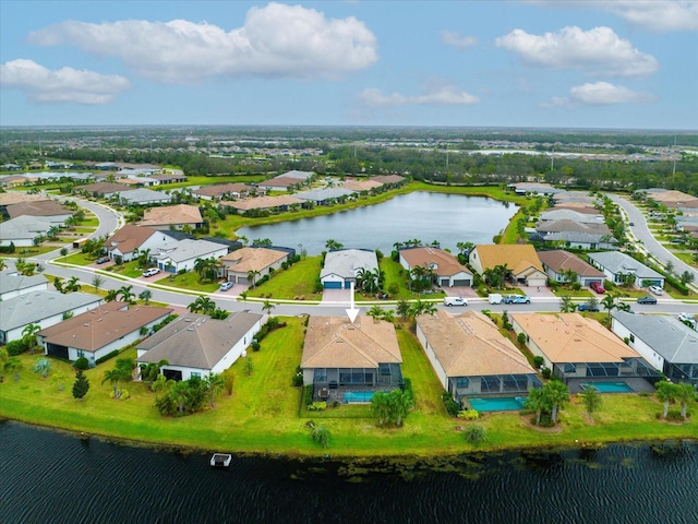 birds eye view of property featuring a residential view and a water view