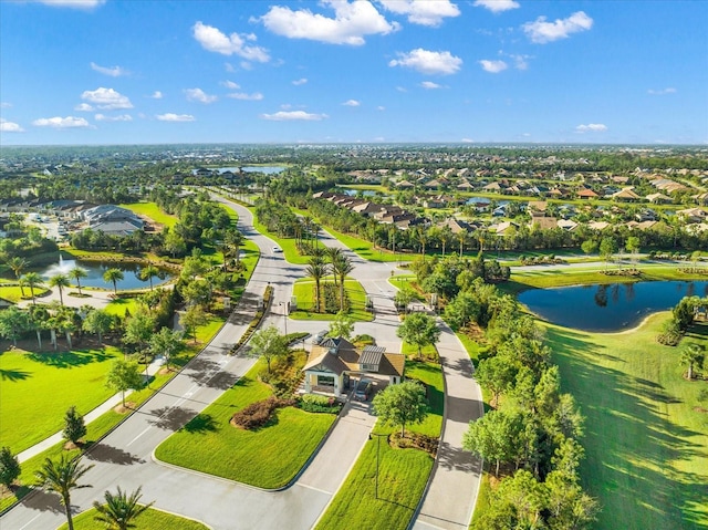 drone / aerial view featuring a residential view and a water view