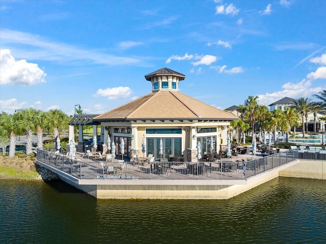 dock area featuring a patio, a pergola, and a water view