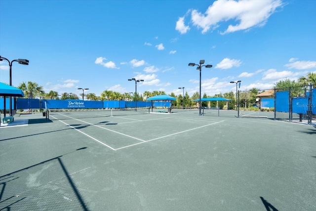 view of sport court featuring fence